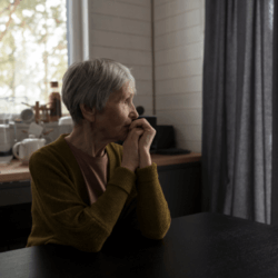 Mature lady in a dark room