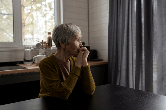 Mature lady in a dark room