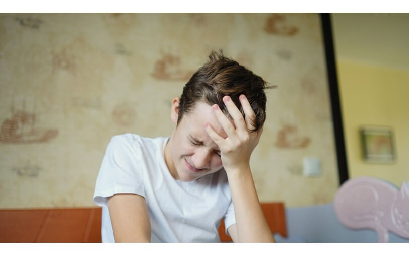 Teenager with headache