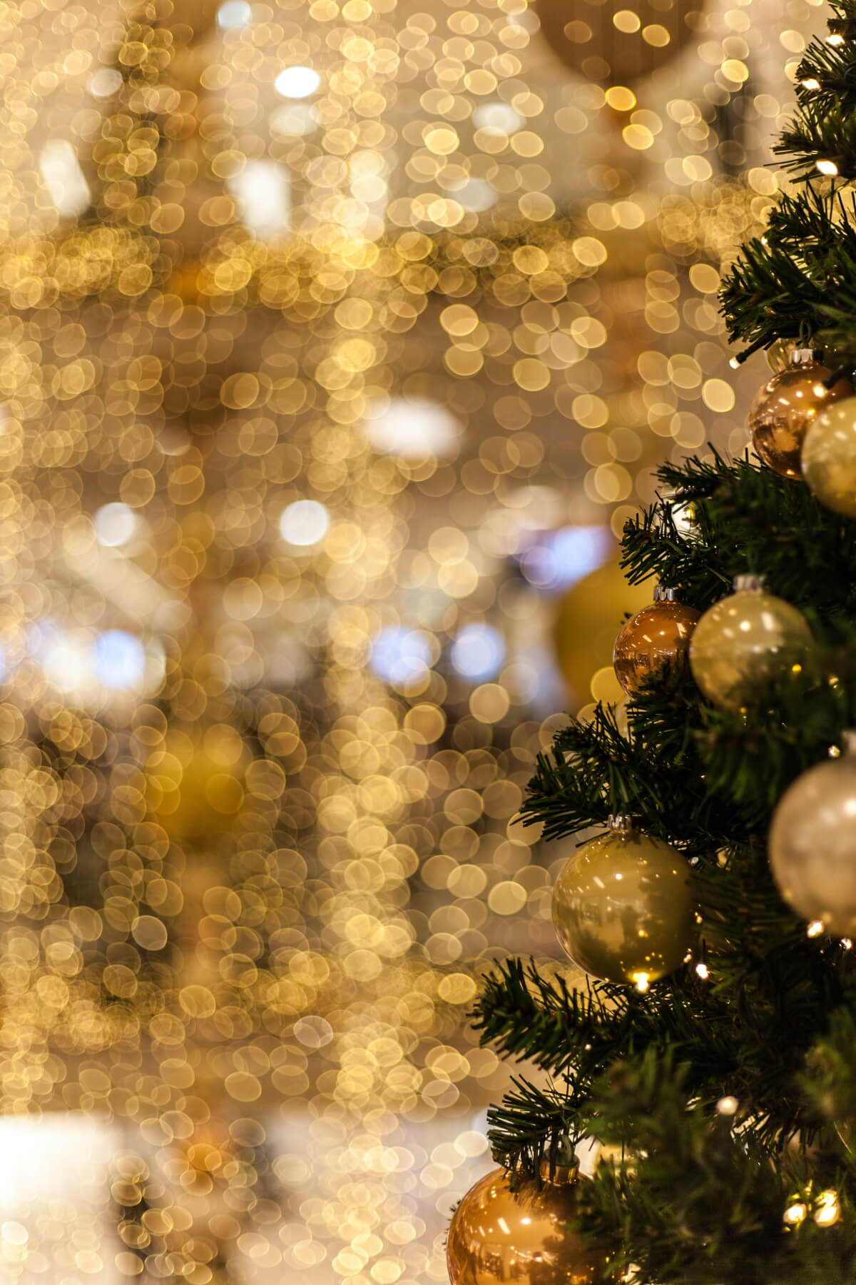 Christmas tree with baubles and golden lights